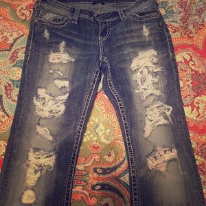 Silver skinny distressed jeans